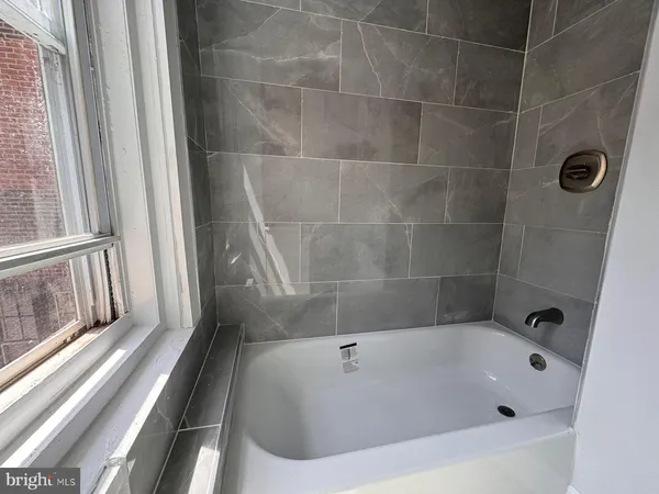 a bathroom with a bathtub