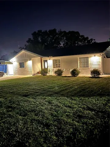 a view of front of house with a yard
