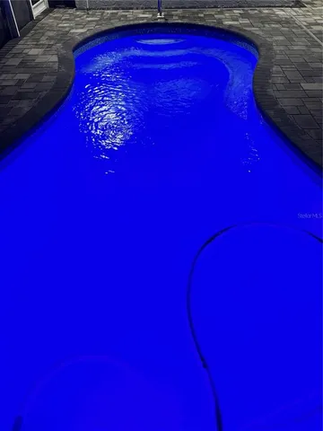 a red sign in a backyard