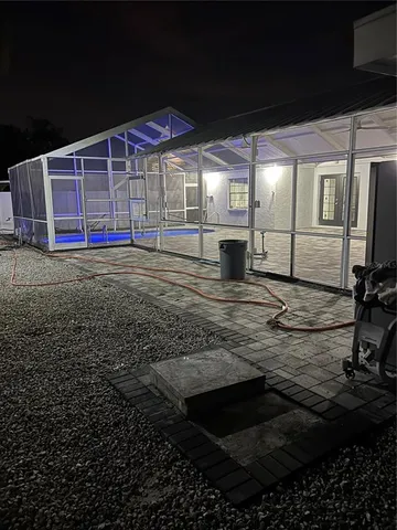 a view of a backyard of the house