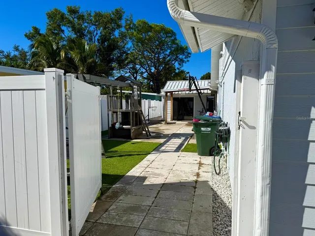 a view of house with patio outdoor seating and yard