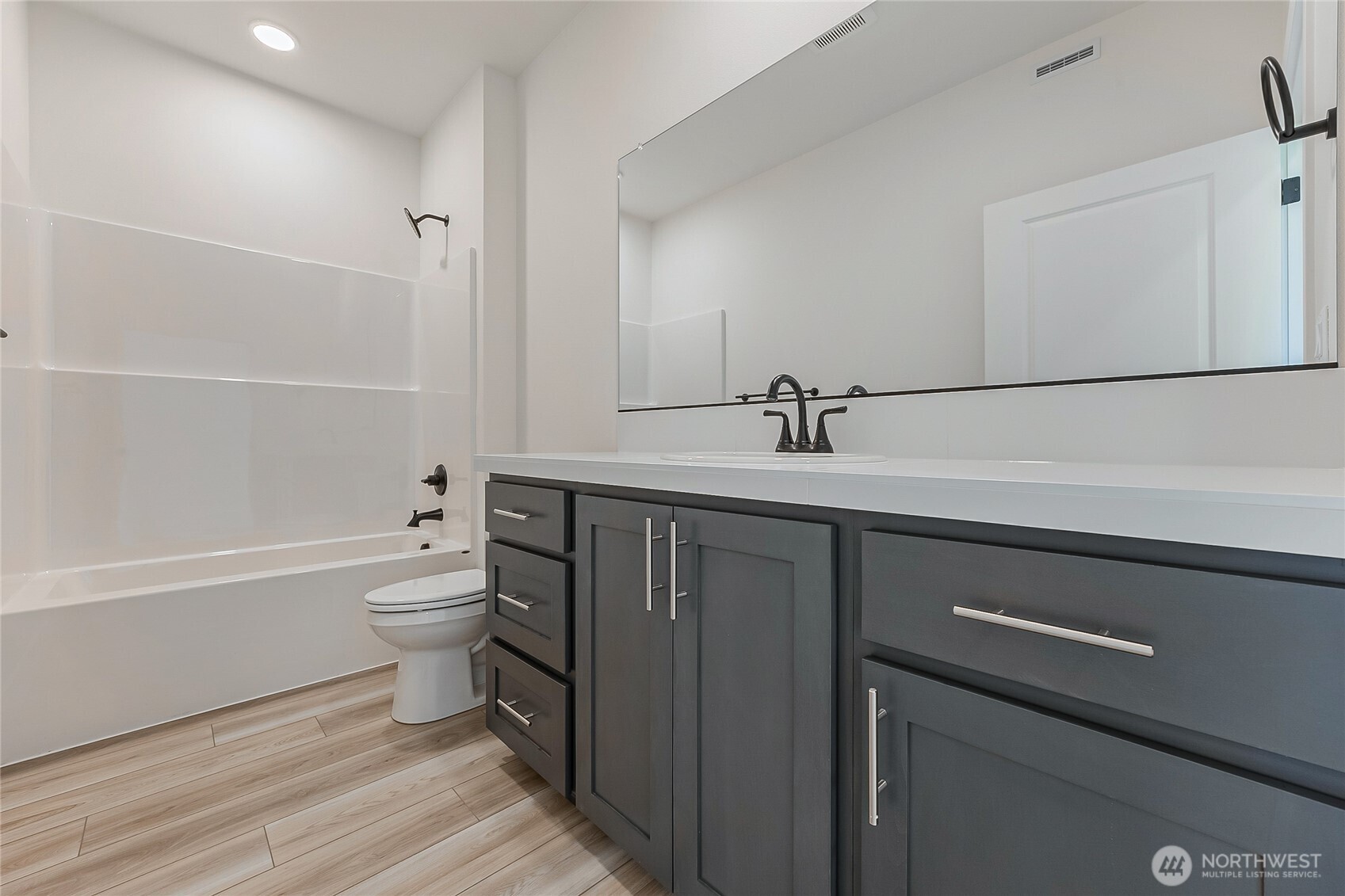 402 Pagget Avenue Winlock, WA 98596 - Photo 13 of 36 a bathroom with a sink a toilet and shower