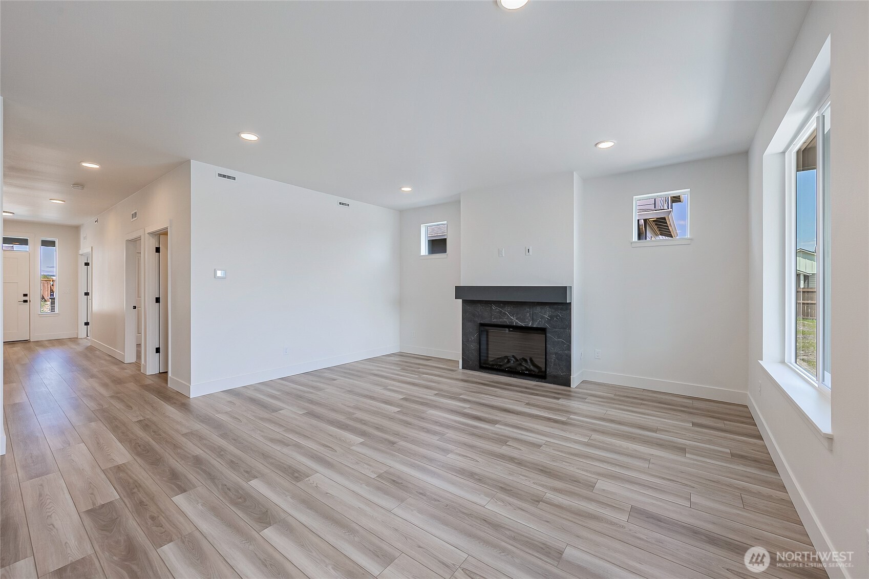402 Pagget Avenue Winlock, WA 98596 - Photo 14 of 36 a view of empty room with wooden floor and fan