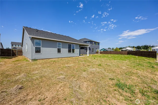 a house with swimming pool in front of it