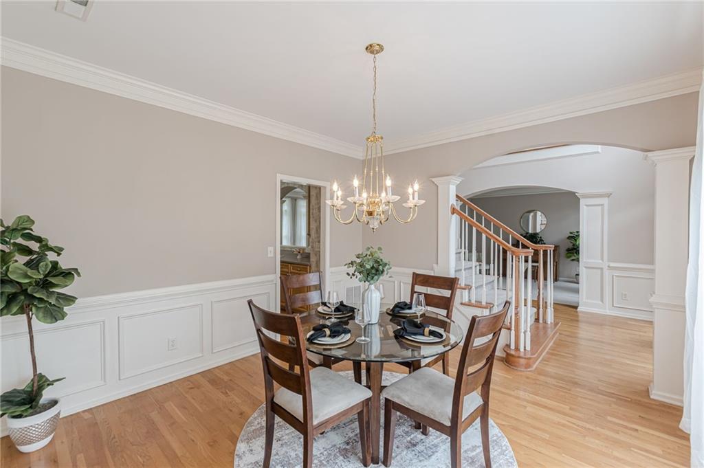 700 James Madison Drive South Fulton, GA 30331 - Photo 14 of 57 a view of a dining room with furniture and wooden floor
