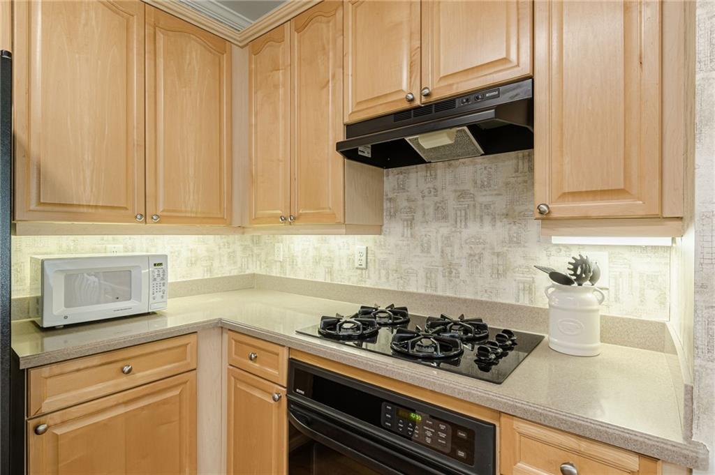 700 James Madison Drive South Fulton, GA 30331 - Photo 20 of 57 a kitchen with a stove and a white cabinet