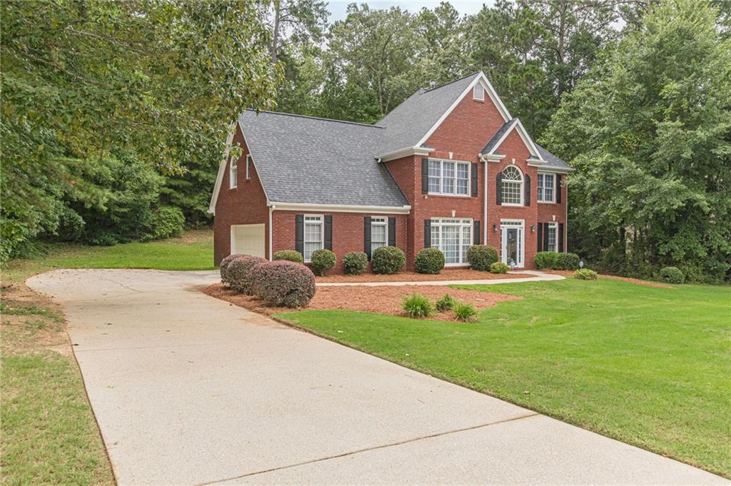 700 James Madison Drive South Fulton, GA 30331 - Photo 2 of 57 a front view of a house with a yard