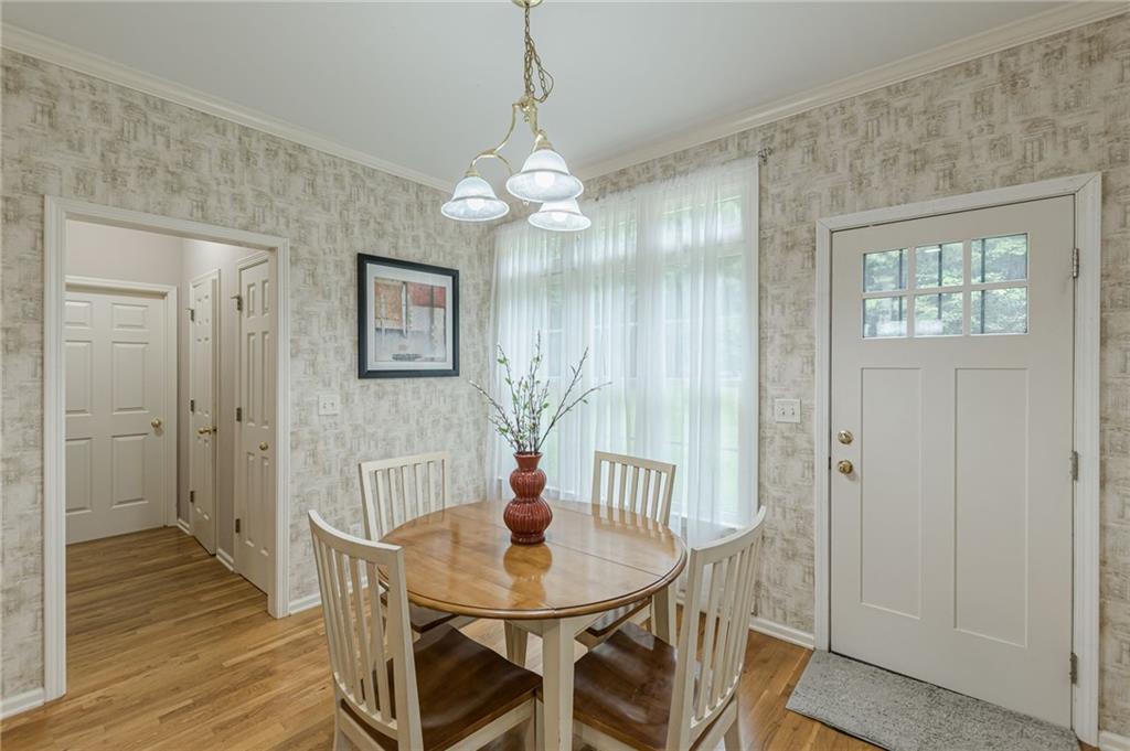 700 James Madison Drive South Fulton, GA 30331 - Photo 24 of 57 a view of a dining room with furniture and wooden floor