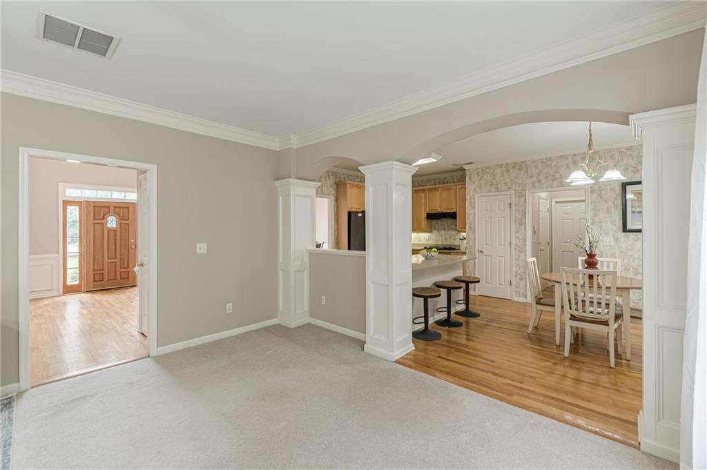700 James Madison Drive South Fulton, GA 30331 - Photo 26 of 57 a view of a livingroom with kitchen and dining area