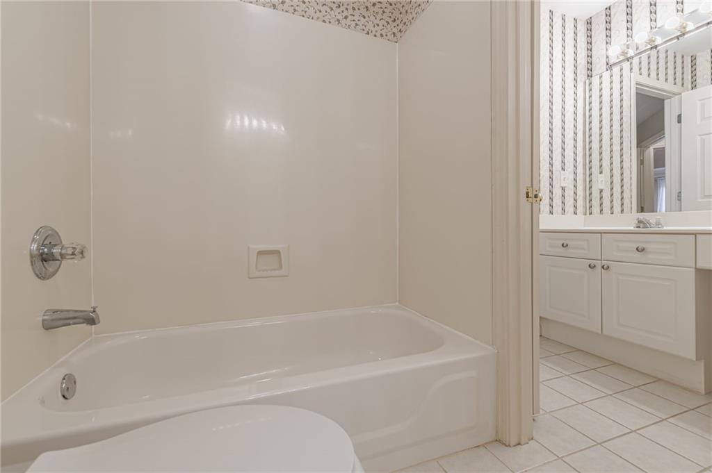 700 James Madison Drive South Fulton, GA 30331 - Photo 39 of 57 a white bath tub sitting next to a window