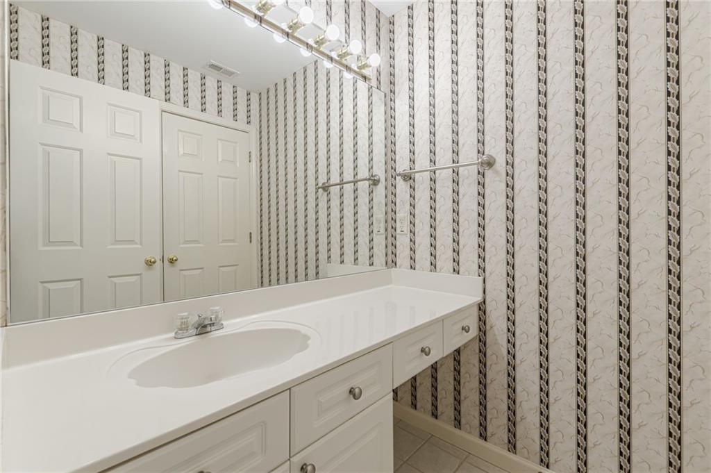 700 James Madison Drive South Fulton, GA 30331 - Photo 40 of 57 a bathroom with a sink and a mirror
