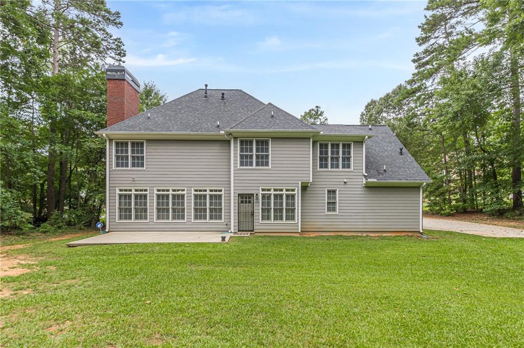 700 James Madison Drive South Fulton, GA 30331 - Photo 4 of 57 a front view of a house with a garden
