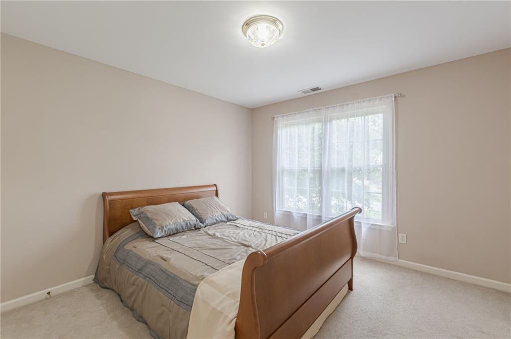 700 James Madison Drive South Fulton, GA 30331 - Photo 41 of 57 a bedroom with a bed and a window