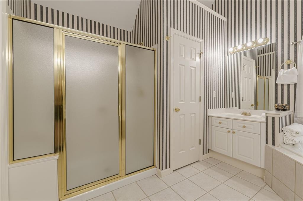 700 James Madison Drive South Fulton, GA 30331 - Photo 57 of 57 a bathroom with a double vanity sink and mirror