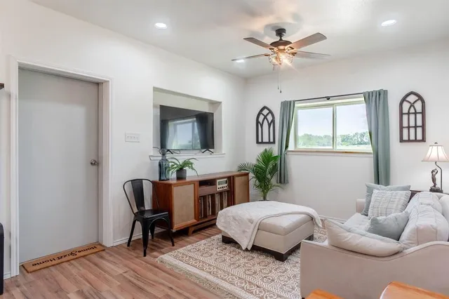 a living room with furniture and a window