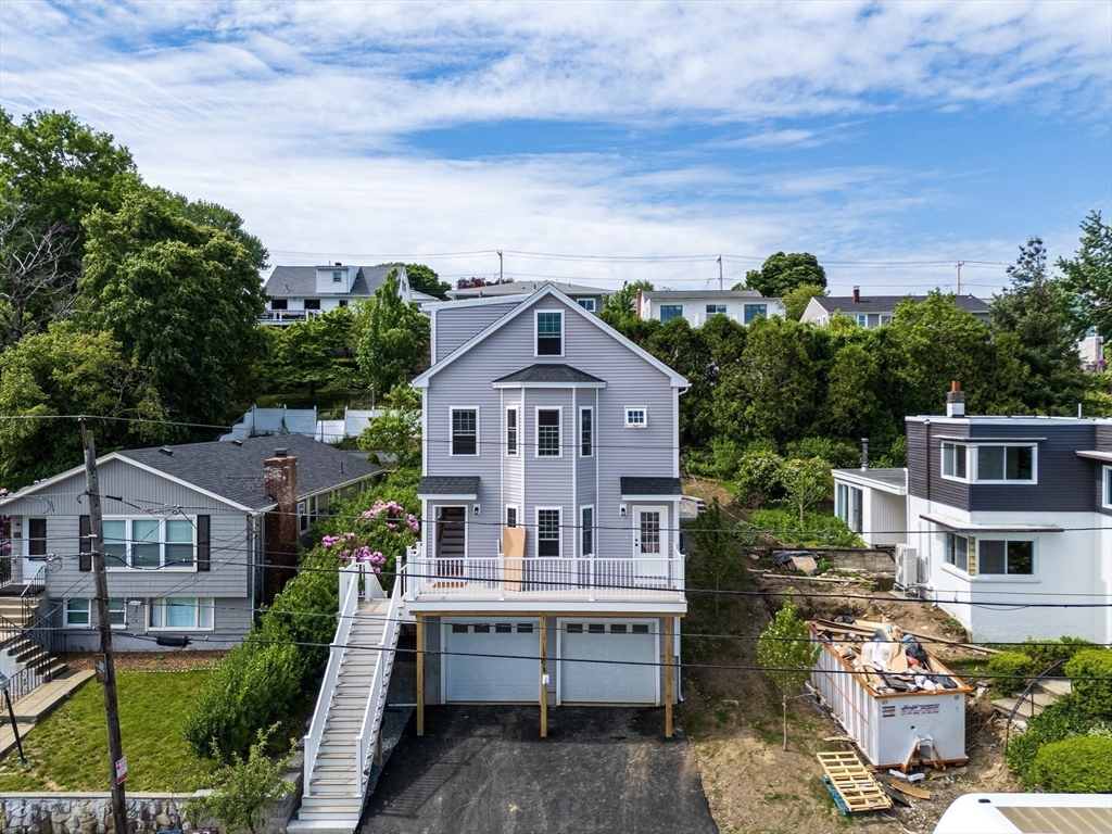 216 Vane Street, Unit 2 Revere, MA 02151 - Photo 20 of 22 aerial view of a house with a yard and potted plants
