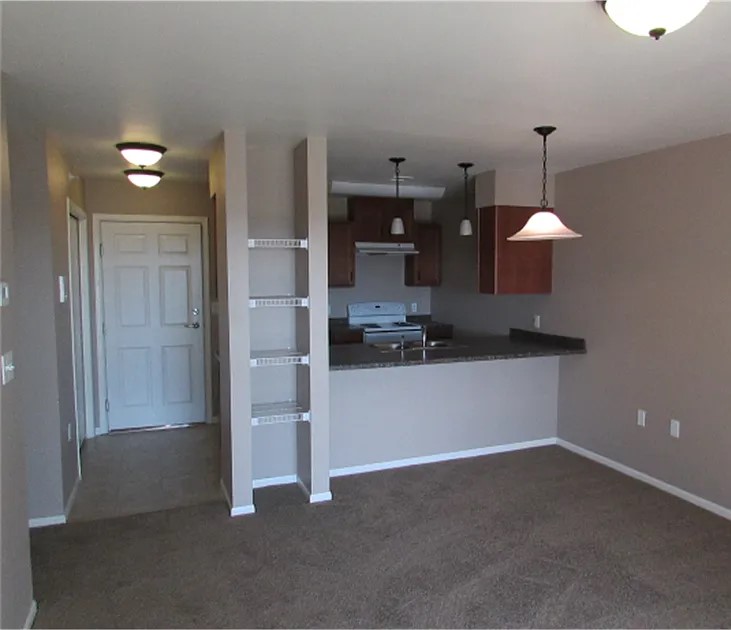 2821 Ithaca Drive Bismarck, ND 58503 - Photo 6 of 8 a view of a kitchen with a refrigerator stove and cabinets