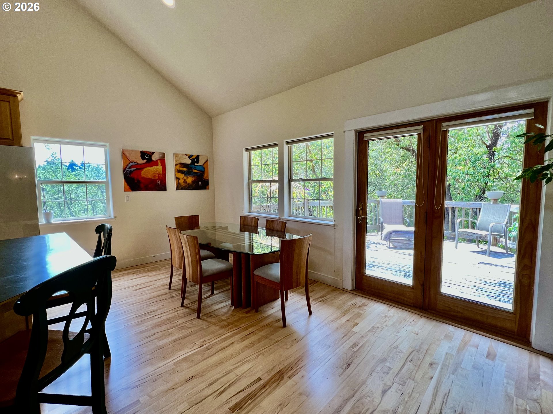 28544 Crow Road Eugene, OR 97402 - Photo 11 of 48 a view of a dining room with furniture and wooden floor