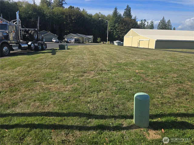 a aerial view of a house with a yard basket ball court and outdoor seating