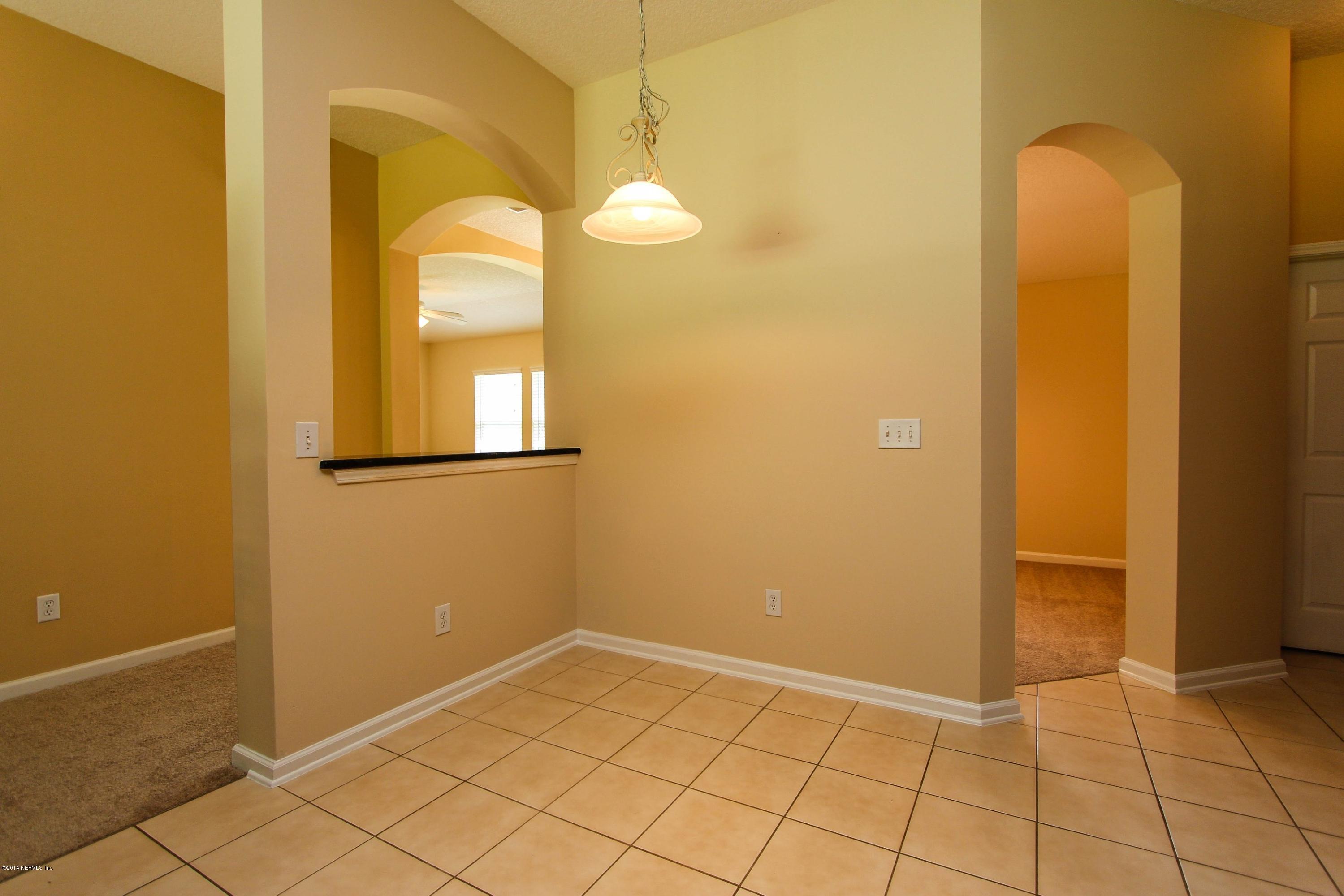 1252 Ribbon Road St. Johns, FL 32259 - Photo 15 of 27 an empty room with windows and entrance