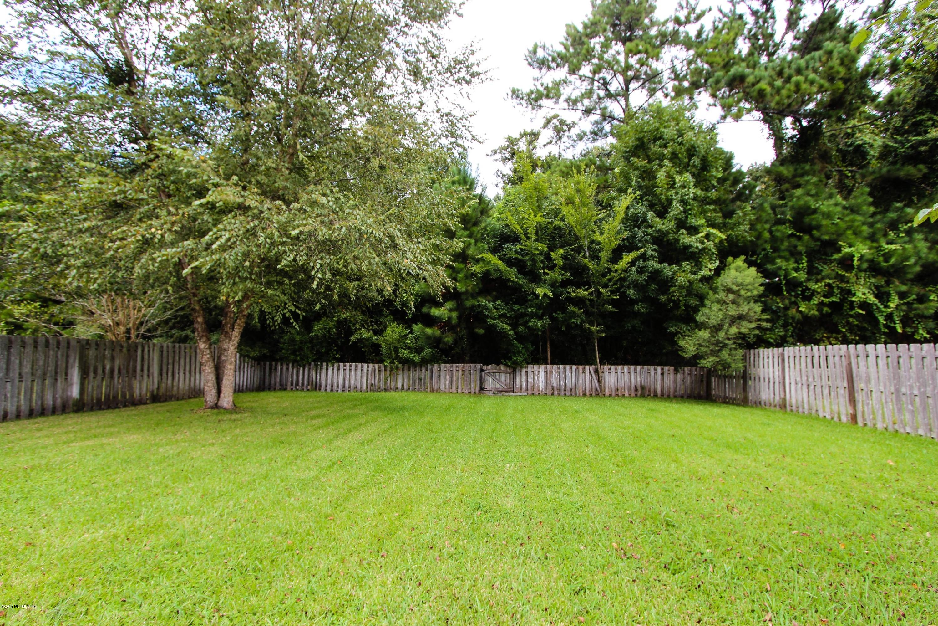 1252 Ribbon Road St. Johns, FL 32259 - Photo 25 of 27 a view of a backyard with a small cabin