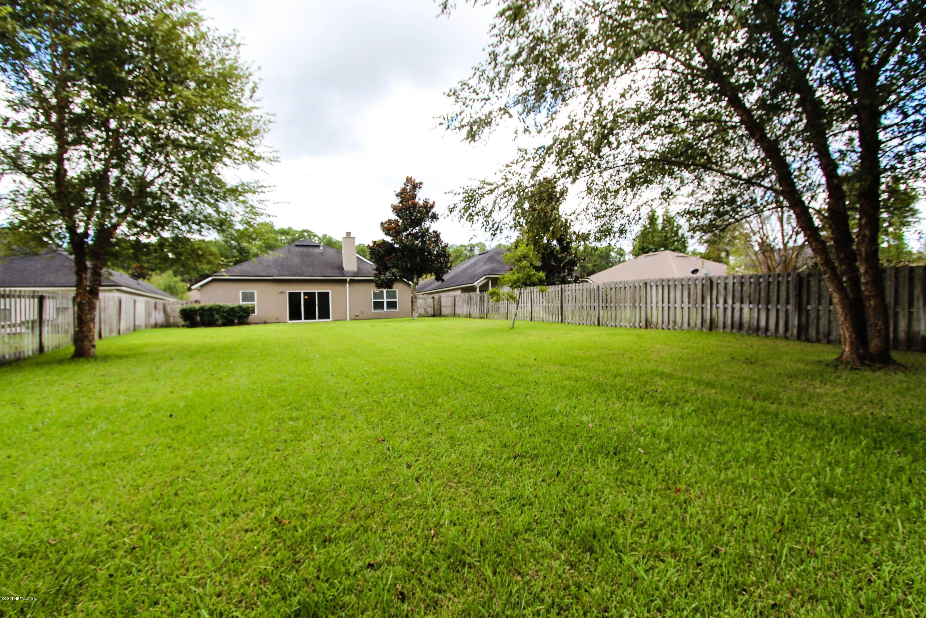 1252 Ribbon Road St. Johns, FL 32259 - Photo 26 of 27 a house view with swimming pool in front of it