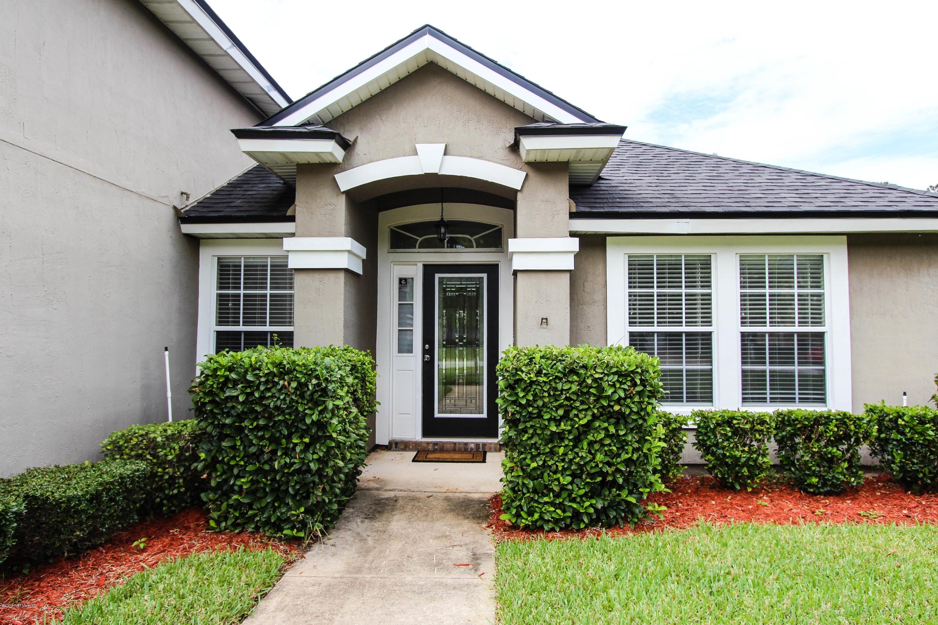 1252 Ribbon Road St. Johns, FL 32259 - Photo 3 of 27 a front view of a house with garden