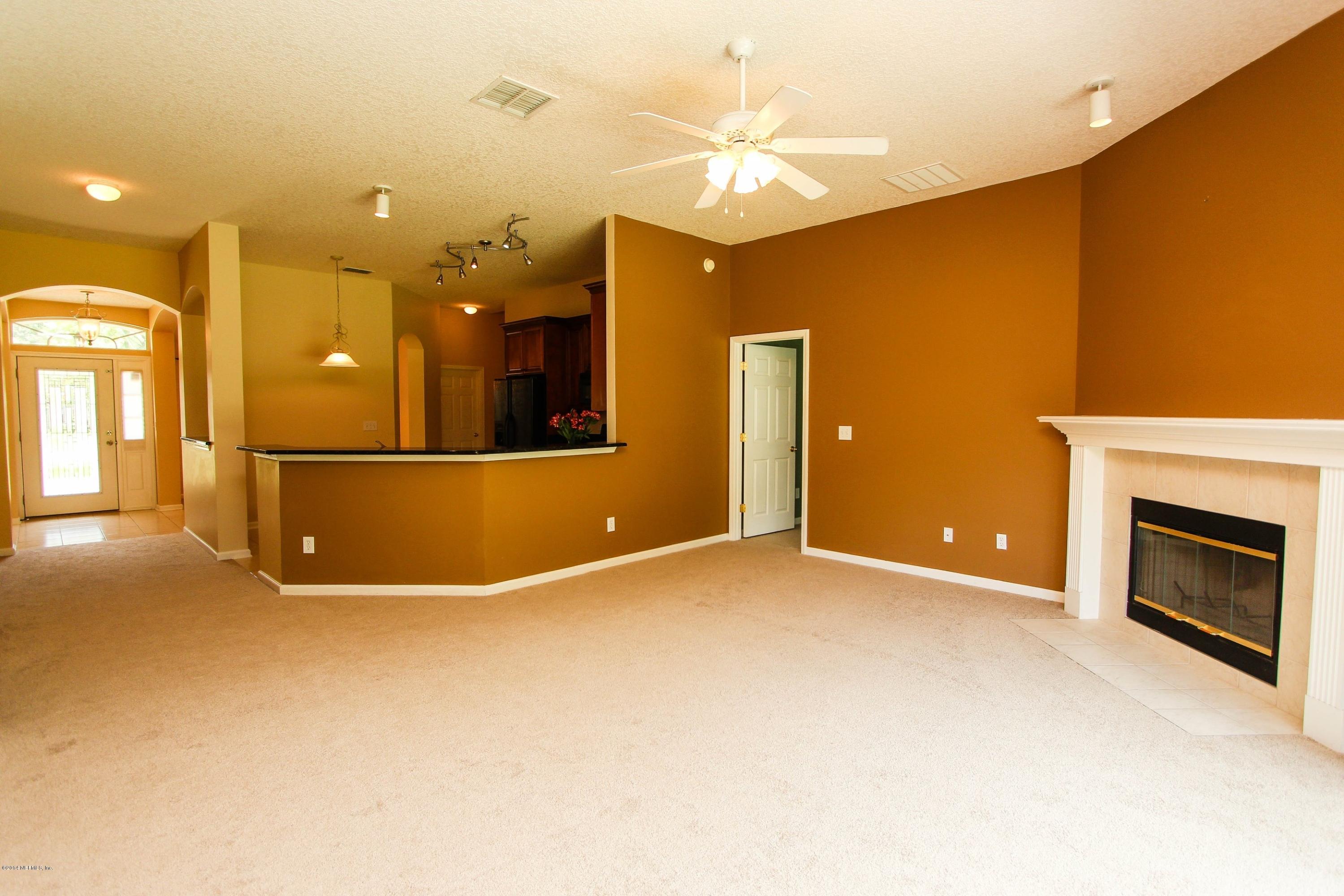 1252 Ribbon Road St. Johns, FL 32259 - Photo 10 of 27 an empty room with a fireplace