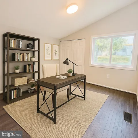 a living room with furniture a rug and a window