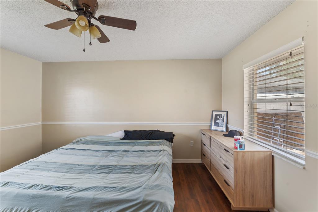 8715 Huntsman Lane Port Richey, FL 34668 - Photo 42 of 54 a bedroom with a bed and window