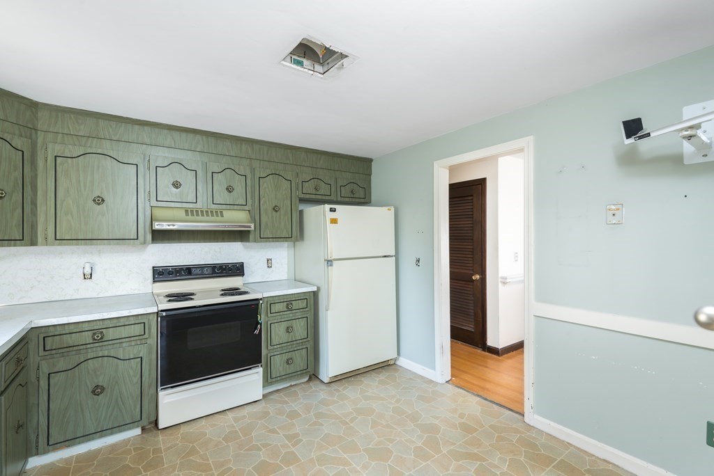 26 Carver Road Plymouth, MA 02360 - Photo 11 of 25 a kitchen with stainless steel appliances granite countertop a refrigerator a stove a sink and white cabinets