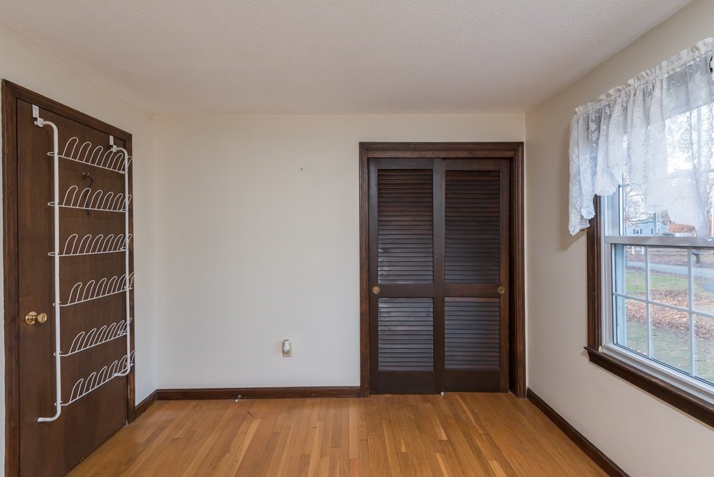 26 Carver Road Plymouth, MA 02360 - Photo 15 of 25 an empty room with wooden floor and windows
