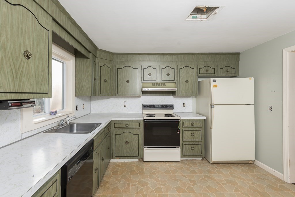 26 Carver Road Plymouth, MA 02360 - Photo 9 of 25 a kitchen with a sink a stove and refrigerator