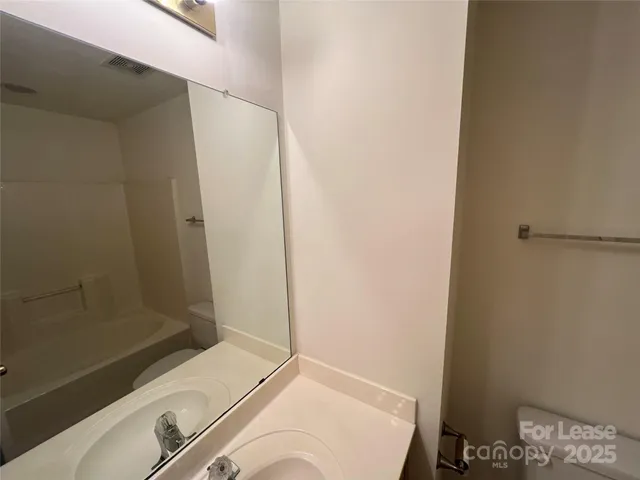 a bathroom with a sink and a shower