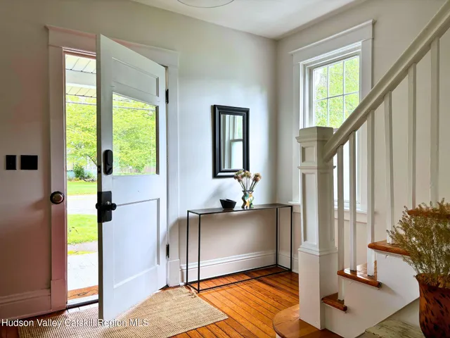 a view of an entryway and livingroom with furniture