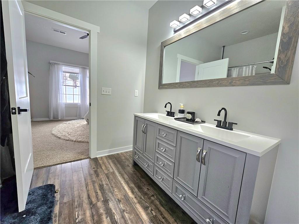 300 7th Avenue New Eagle, PA 15067 - Photo 12 of 22 a spacious bathroom with a double vanity sink a mirror and a shower