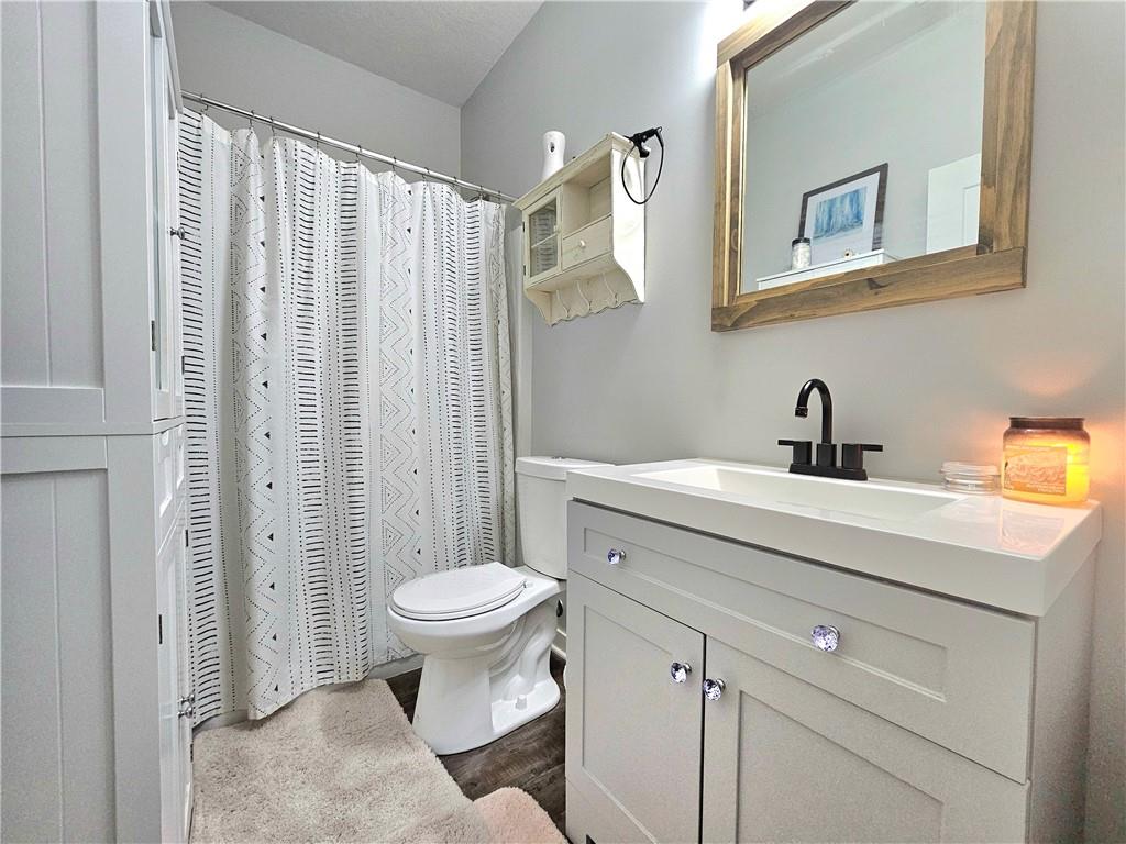 300 7th Avenue New Eagle, PA 15067 - Photo 15 of 22 a bathroom with a sink toilet and shower