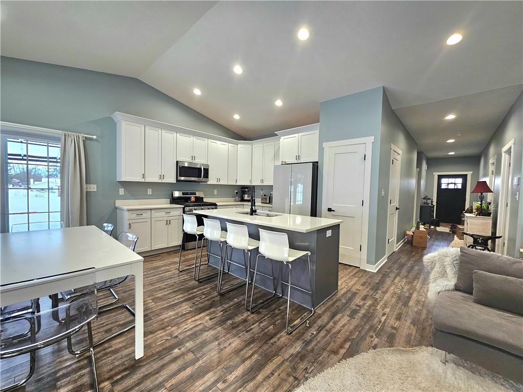 300 7th Avenue New Eagle, PA 15067 - Photo 5 of 22 a large kitchen with kitchen island a sink a stove a center island and a refrigerator