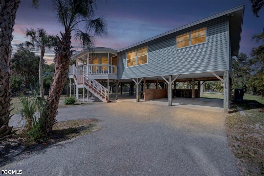 16380 Arbor Ridge Drive Fort Myers, FL 33908 - Photo 1 of 47 a view of the house with a street