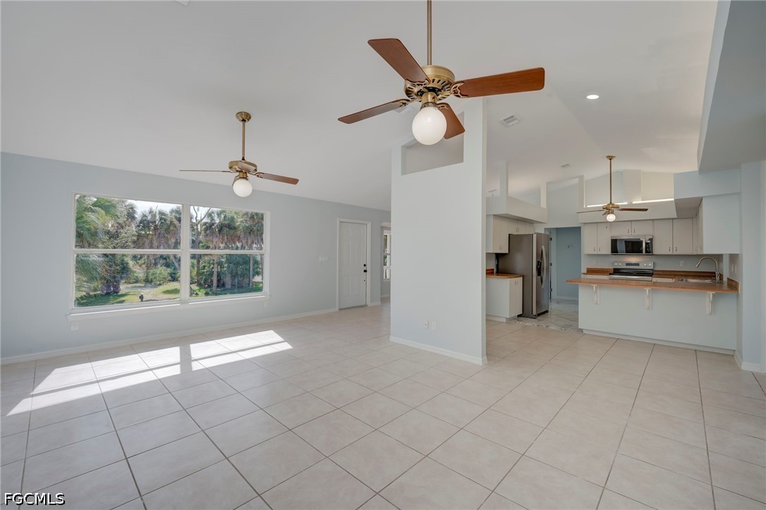 16380 Arbor Ridge Drive Fort Myers, FL 33908 - Photo 11 of 47 a view of a kitchen with furniture and stainless steel appliances