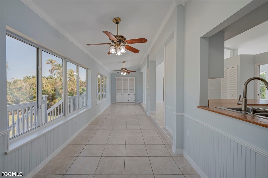 16380 Arbor Ridge Drive Fort Myers, FL 33908 - Photo 20 of 47 a view of a hallway with a chandelier