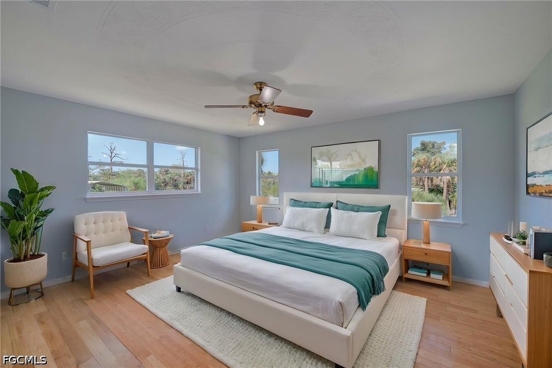 16380 Arbor Ridge Drive Fort Myers, FL 33908 - Photo 24 of 47 a bedroom with a bed and a window