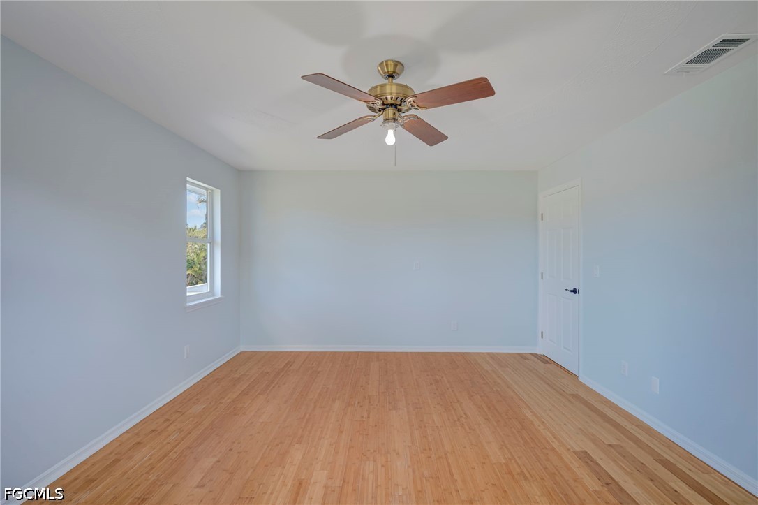 16380 Arbor Ridge Drive Fort Myers, FL 33908 - Photo 26 of 47 a view of empty room with wooden floor
