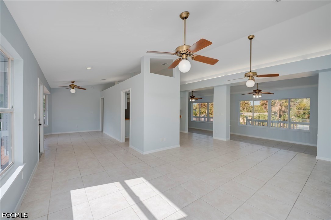 16380 Arbor Ridge Drive Fort Myers, FL 33908 - Photo 3 of 47 a view of a hallway with a chandelier fan and windows