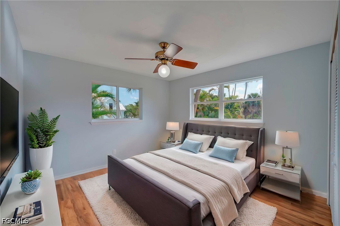 16380 Arbor Ridge Drive Fort Myers, FL 33908 - Photo 31 of 47 a bedroom with a bed and a chandelier