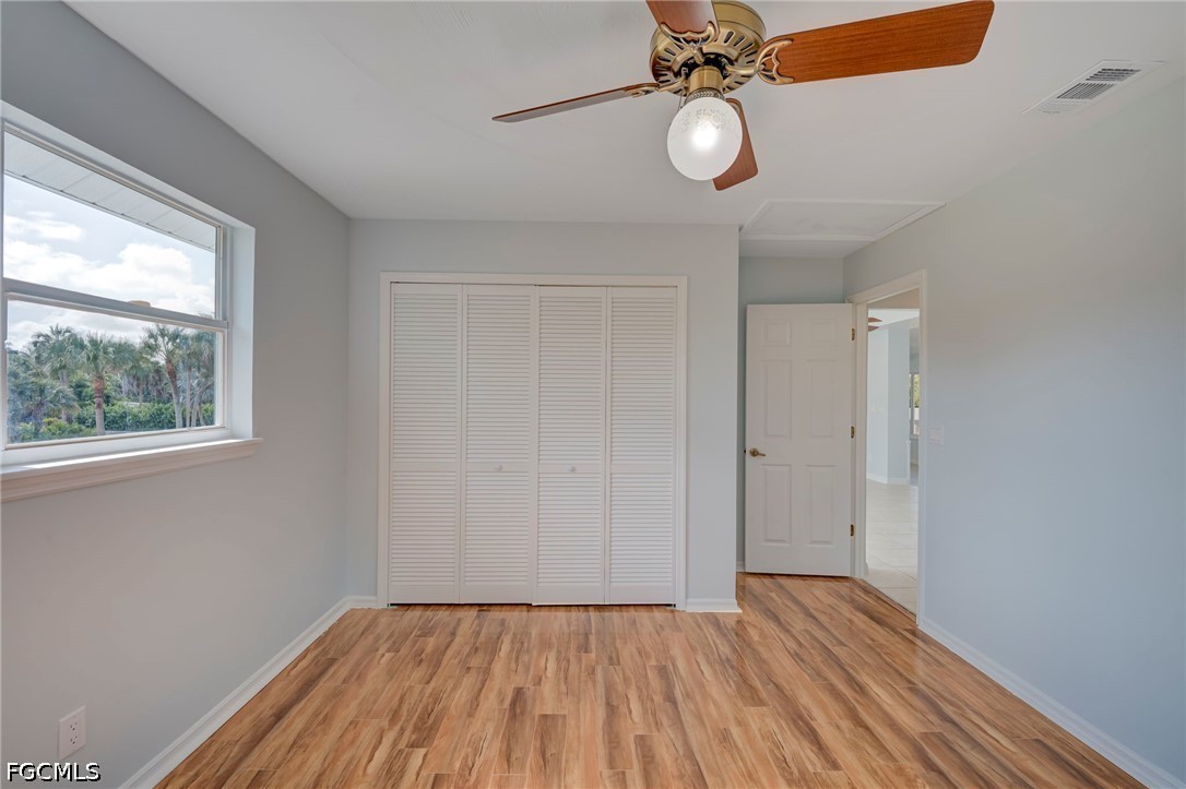 16380 Arbor Ridge Drive Fort Myers, FL 33908 - Photo 33 of 47 a view of empty room with wooden floor and fan