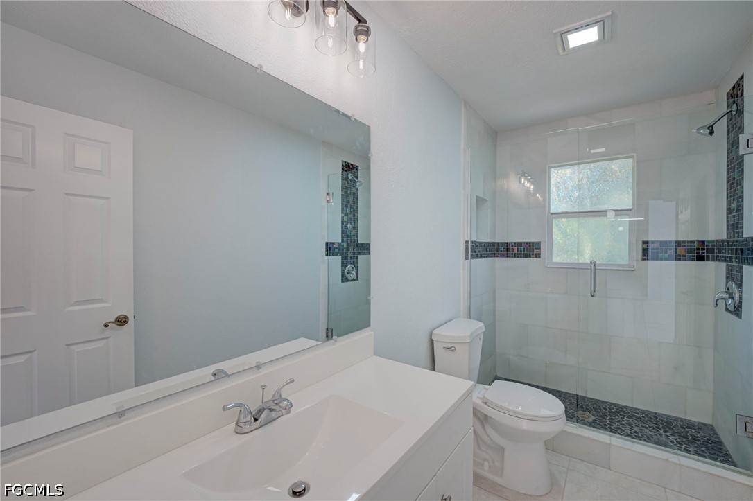 16380 Arbor Ridge Drive Fort Myers, FL 33908 - Photo 34 of 47 a bathroom with a sink a toilet and shower