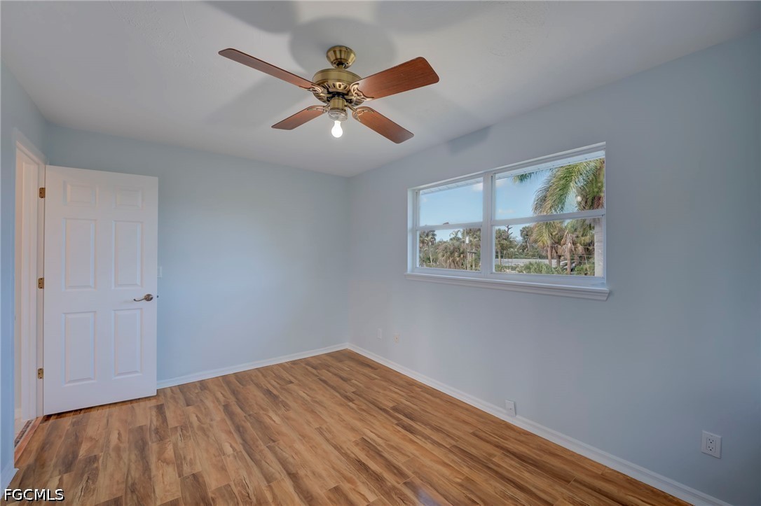 16380 Arbor Ridge Drive Fort Myers, FL 33908 - Photo 38 of 47 a view of a hallway with wooden floor