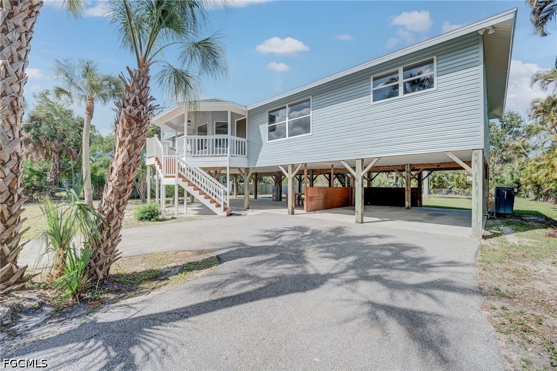 16380 Arbor Ridge Drive Fort Myers, FL 33908 - Photo 42 of 47 a view of a house with a yard and potted plants