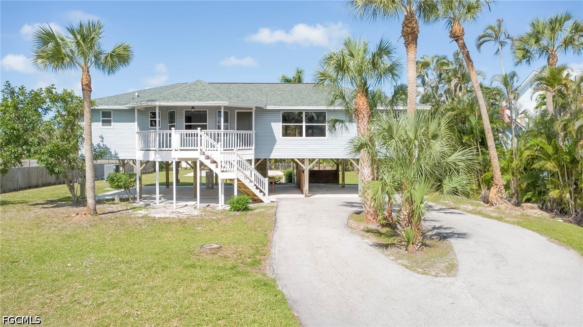 16380 Arbor Ridge Drive Fort Myers, FL 33908 - Photo 43 of 47 a view of a house with backyard porch and sitting area